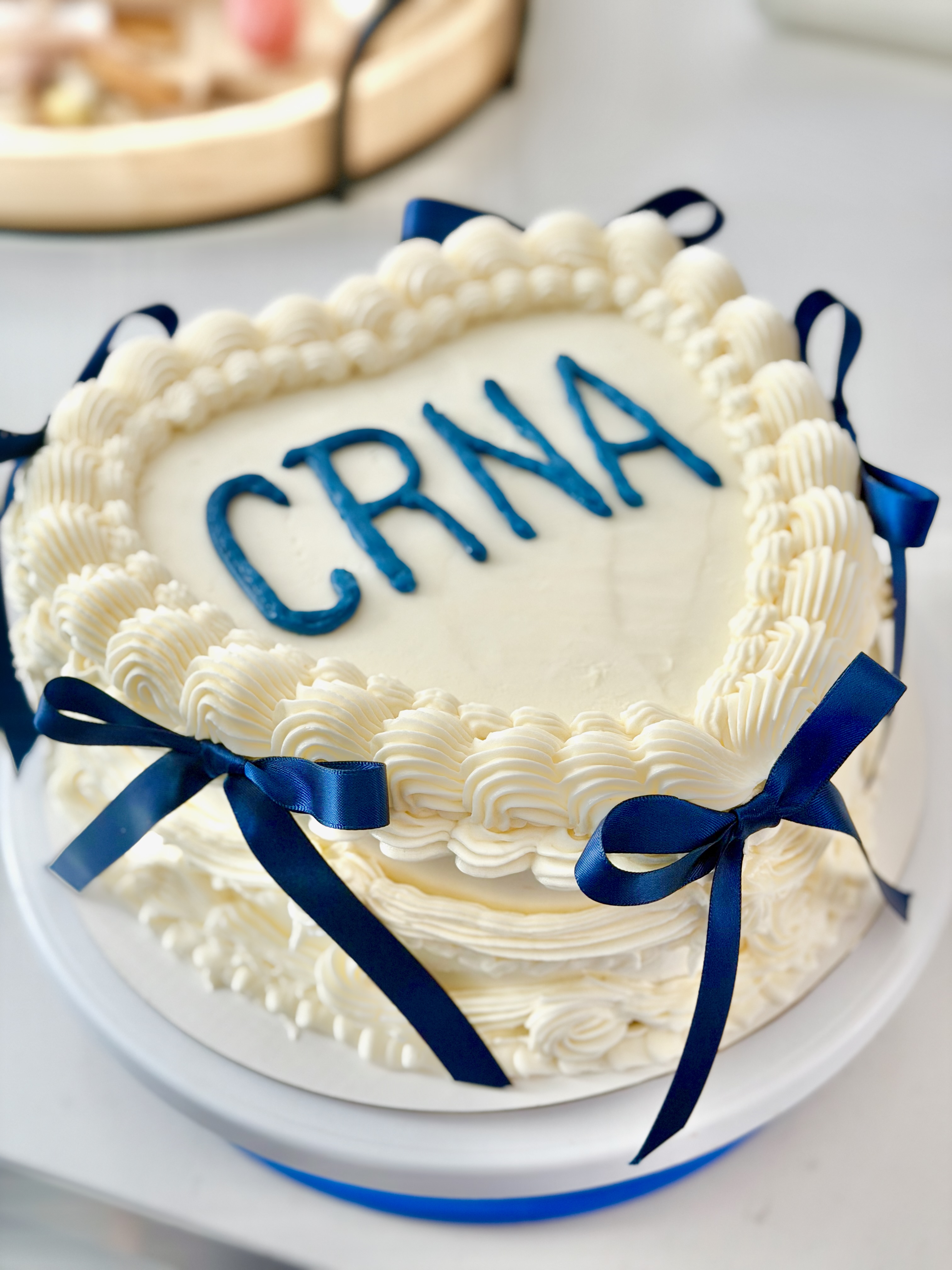 Heart cake with blue ribbons